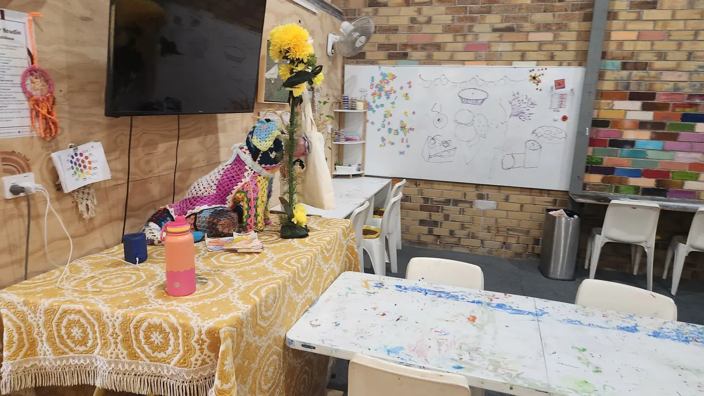 Art studio table setup with creative materials and workshop seating at Social Co House
