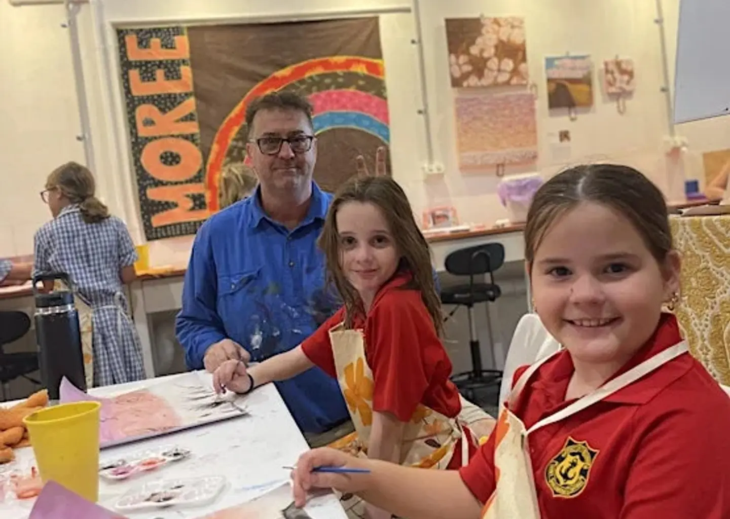 Children painting together during Creative Minds After School in the art studio